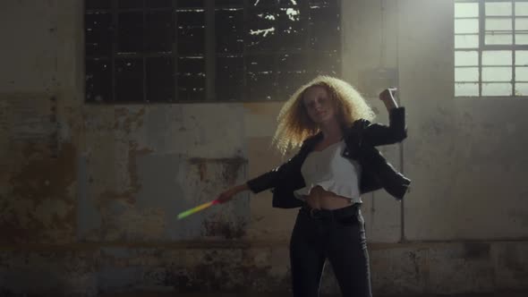 Fashionable young woman in an abandoned warehouse