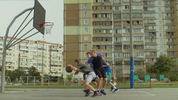 Streetball Player Taking Layup Shot on Basketball Court