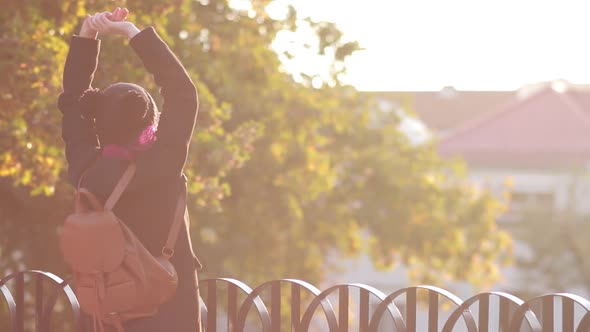 Pretty Young Girl Taking Pictures of Sunset