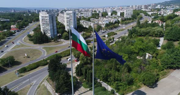 Bulgarian and European Union flags waving on the wind. 4K aerial dron video of Varna, Bulgaria.