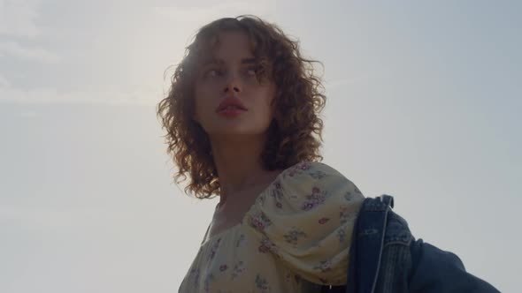 Serious Sexy Woman Looking Into Distance Posing in Front Bright Sunlight Closeup