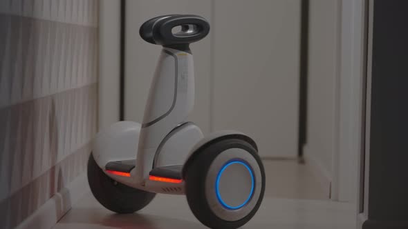 White Modern Gyro Scooter Gadget Balances Itself and Spins with Intelligence Avoids Obstacles in the