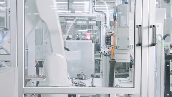 Advanced robotic machine manufacturing parts in an automated assembly line