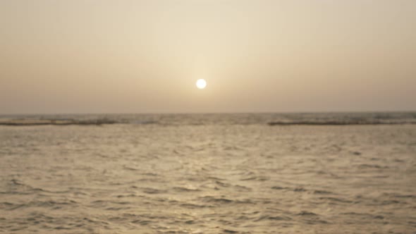 Gay couple walking on the beach together during sunset