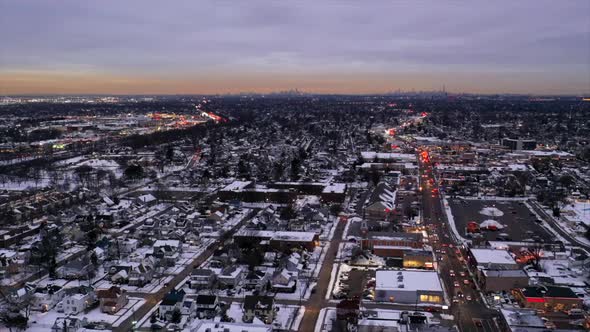 an aerial time lapse with traffic in motion, just after sunset as night begins to fall. The drone ca