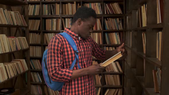African American Young Student Studying at the School University Library