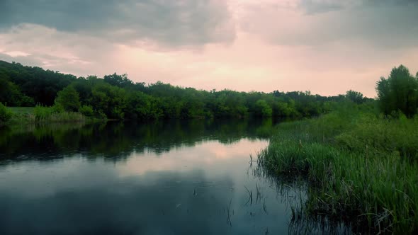 Flight Over River During Rain at Sunset