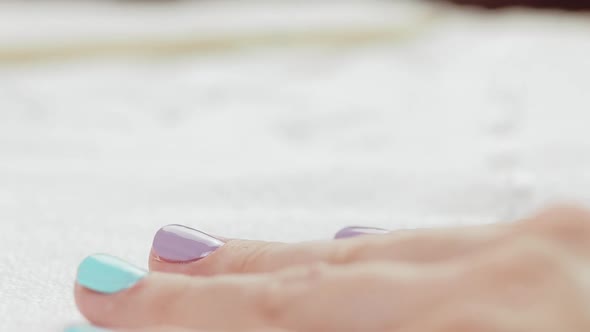 Young Woman Paints Her Nails with Natural Gel Base. Nails Manicure. 