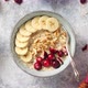 Ceramic Bowl of Oatmeal Porridge with Banana Fresh Cranberries and Walnuts - VideoHive Item for Sale