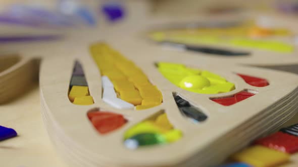 Male Hands Create Mosaics with Tweezers and Bright Little Pieces of Glass and Ceramics