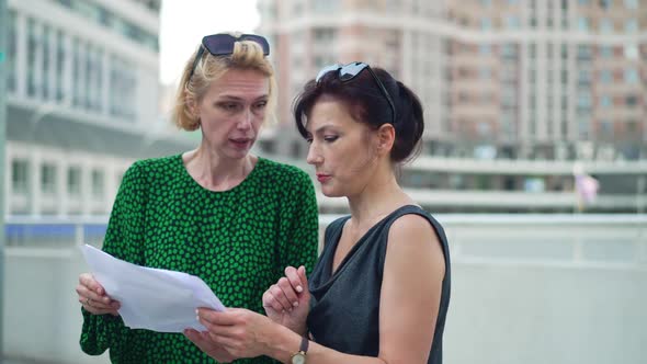 Two Confident Gorgeous Businesswomen Discussing Project Shaking Hands Smiling