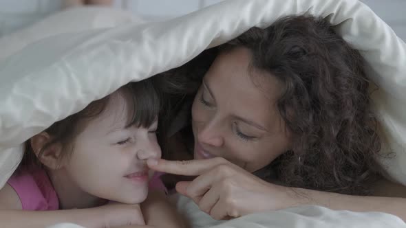 Family under the covers.