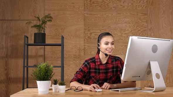 Beautiful freelancer female talking in a video conference