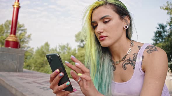 Girl with Multicolored Yellow Blue Hair at the Park