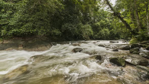 Timelapse water flow over rock at Sungai Sedim