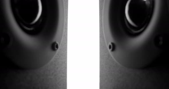 Sliding Between Two Lying Speakers with Vibrating Bass