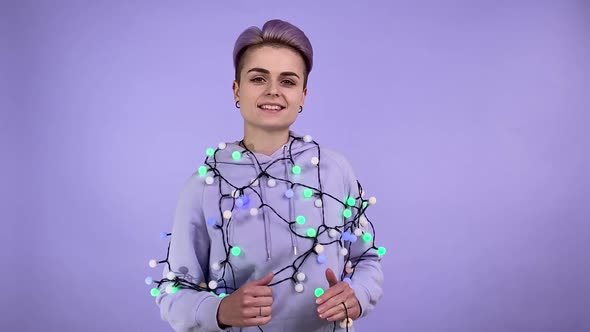 Young Woman Hung Glowing Festival String Lights Dancing Happily Indoor