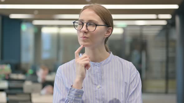 Portrait of Pensive Young Woman Thinking