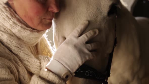 An Elderly Woman Loves Her Horse Kisses Hugs Strokes and Talks to Her