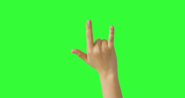 Isolated Woman Hand Waving with horns Showing The Rock-n-Roll Sign Symbol on the green screen