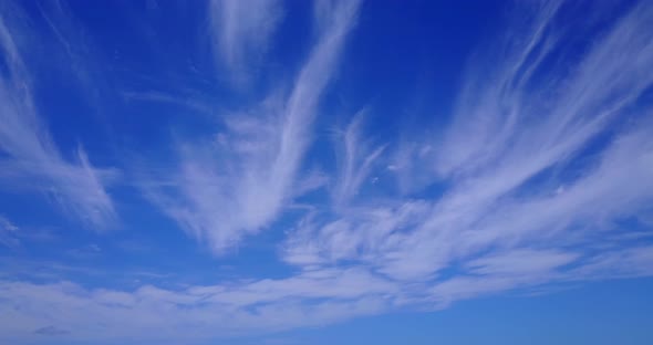 Tropical fly over clean view of a paradise sunny white sand beach and aqua turquoise water backgroun