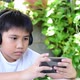The Boy Playing A Game On Smartphone - VideoHive Item for Sale