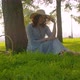 Poetic Beautiful Girl Sitting in A Park - VideoHive Item for Sale