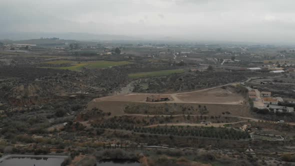 Camera flight over biogas plant near pig farm in rapeseed fields