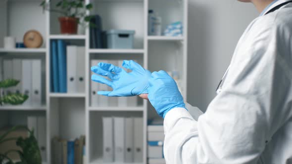 Doctor Or Nurse Puts On Blue Nitrile Surgical Gloves, Professional Medical Safety, Hygiene Surgery