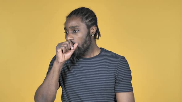 Sick Casual African Man Coughing Isolated on Yellow Background