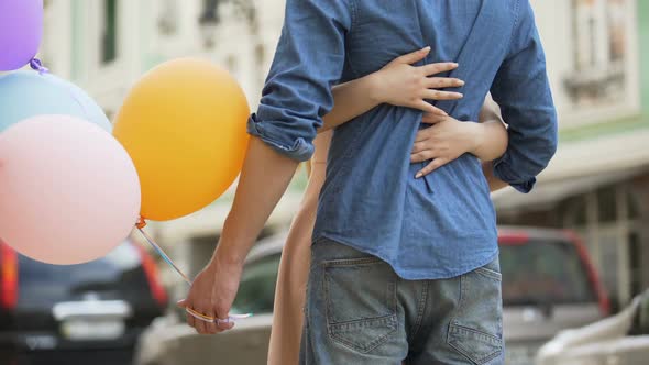 Guy with Balloons Waiting for Date, Girl Approaching and Hugging Him, Meeting