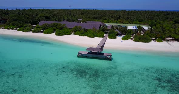 Natural fly over copy space shot of a white sand paradise beach and blue sea background in colorful 