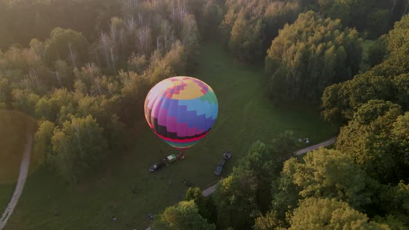 Aerial View of Colorful Hot Air Balloon Prepare for an Summer Early Morning Flying in Park in Small