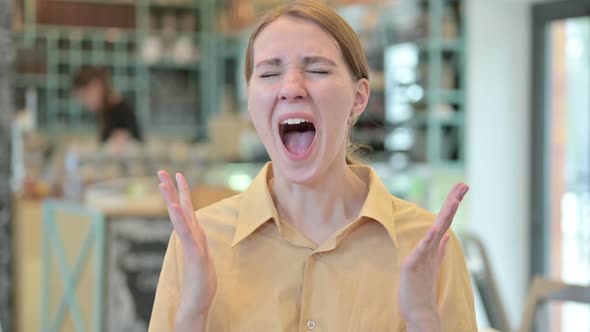 Portrait of Annoyed Young Woman Shouting Screaming