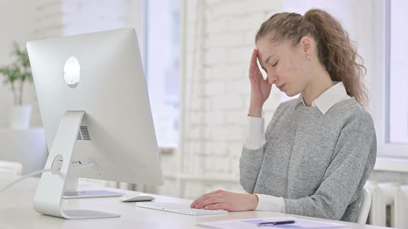 Tired Young Latin Woman Having Headache in Loft Office