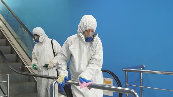 Disinfector Wearing Protective Suits Disinfecting Stairs with Spray Chemicals, Prevent Coronavirus