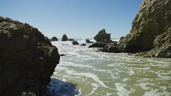 Waves reaching the shore of El Matador Beach