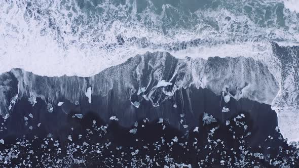 Drone Over Surf of Diamond Beach Iceland