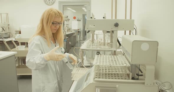 Scientist working in a pharmaceutical laboratory conducting experiments