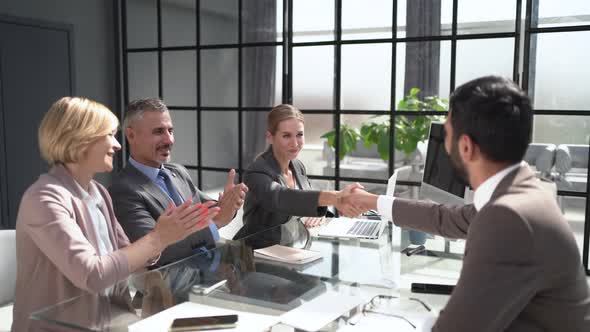 Business People Shaking Hands Finishing Up a Meeting