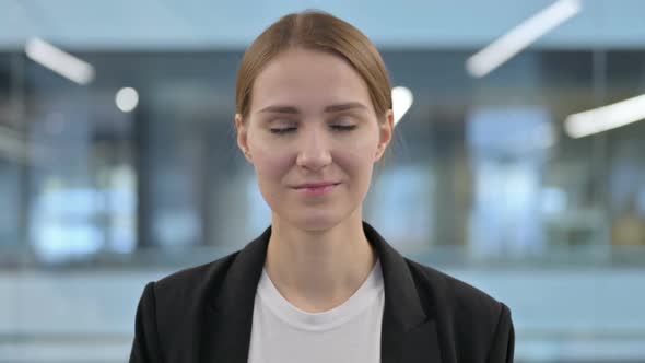 Portrait of Businesswoman Shaking Head As Yes Sign