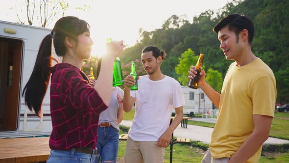 Group of Asian man and woman are having new year party outdoor in the evening together.