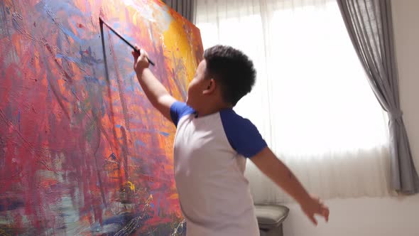 Little Boy Painting Abstract At Home