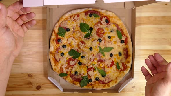 Pizza Close-up. Delivery of Products. Pizza with Cheese, Tomatoes and Olives