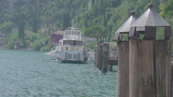 Pubilc transportation ferry on the lake garda in Riva Del Garda North Italy in slowmotion,  close up