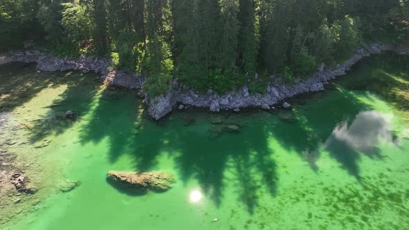 Emerald lake at Fusine with Mangart mountain