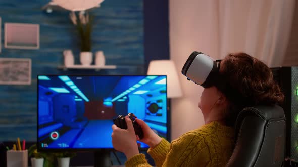 Experienced Gamer Wearing VR Playing at Home Video Game