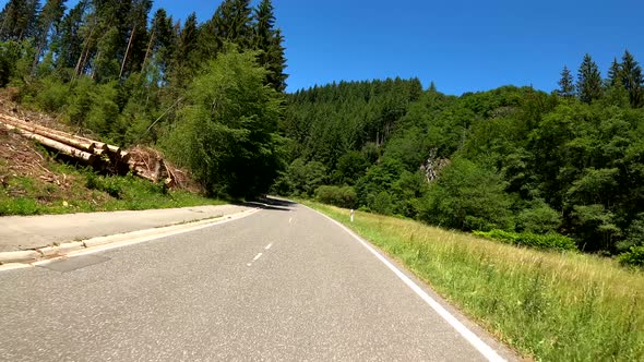 POV Driving on motorcycle on a scenic road in Eifel National Park in Germany