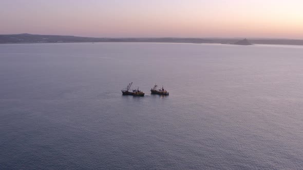 Fishing Trawlers at Sea in the Early Morning Aerial View