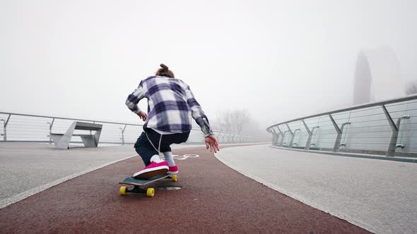 Rear View of a Professional Skater Demonstrating Different Riding Styles